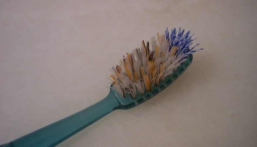 Clean the screen door rollers with a toothbrush. Clean the screen door rollers with a toothbrush.