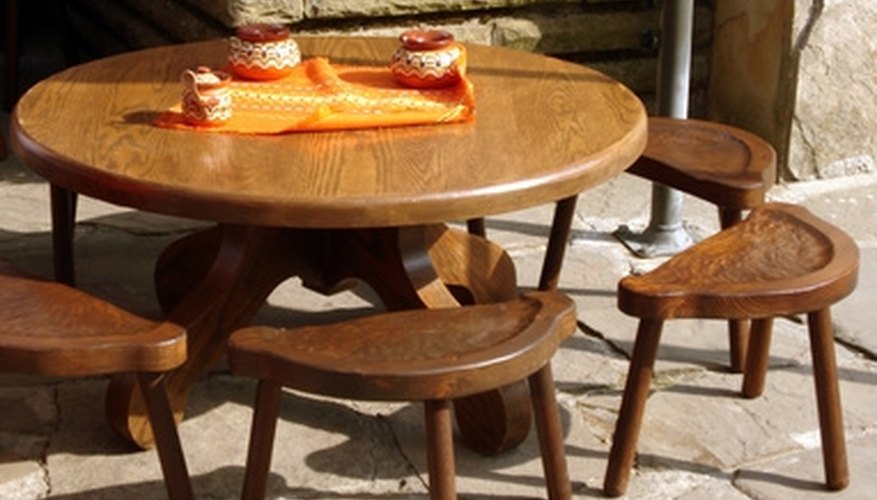 Sand a wood table for a smooth finish. Sand a wood table for a smooth finish.