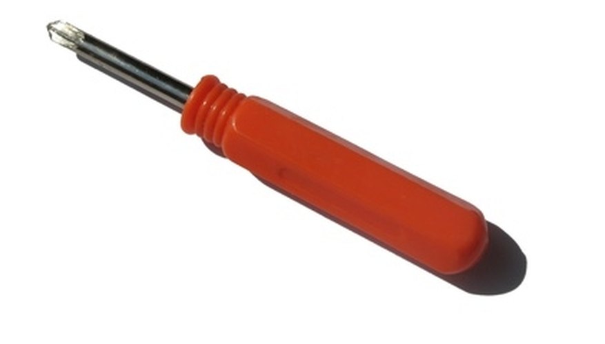 Remove the screws that hold the receptacle cover in place. Remove the screws that hold the receptacle cover in place.