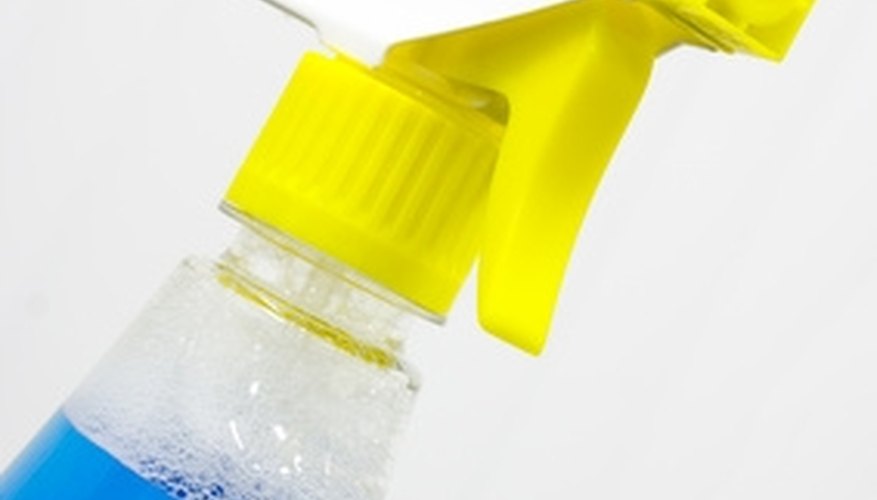 Spray the glass with glass cleaner. Spray the glass with glass cleaner.