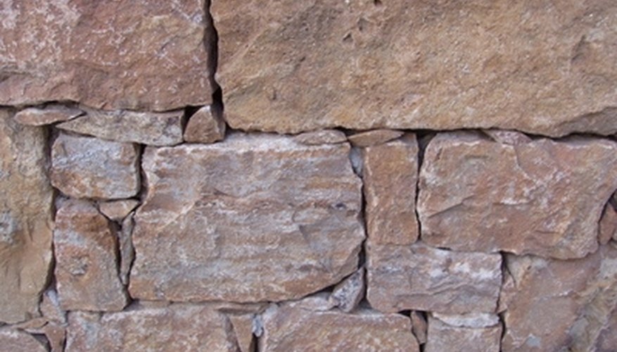 Retaining wall blocks are split to create a natural edge. Retaining wall blocks are split to create a natural edge.