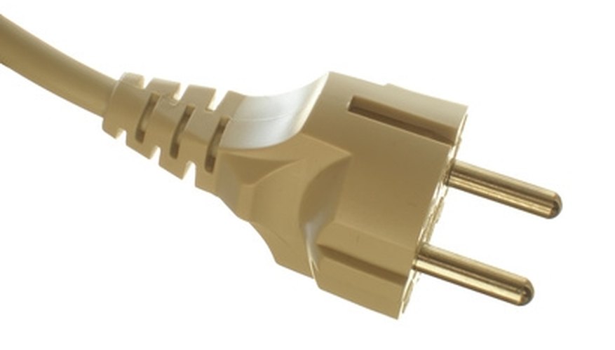 An extension cord plug without a ground. An extension cord plug without a ground.