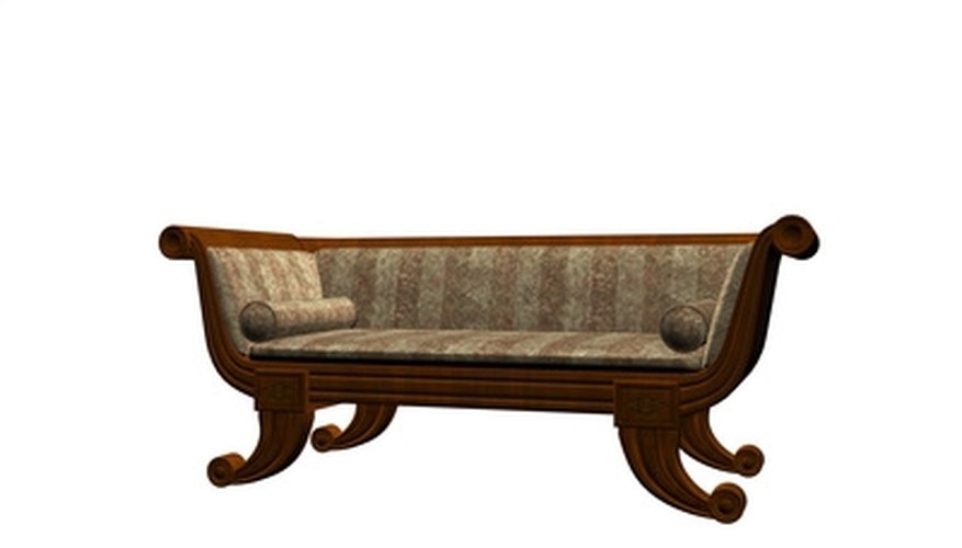This settee displays the curved legs and straight back characteristic of the Empire style. This settee displays the curved legs and straight back characteristic of the Empire style.
