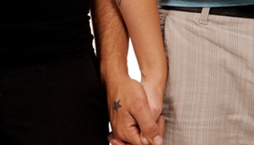 Interlocking fingers is a sign of love. Interlocking fingers is a sign of love.