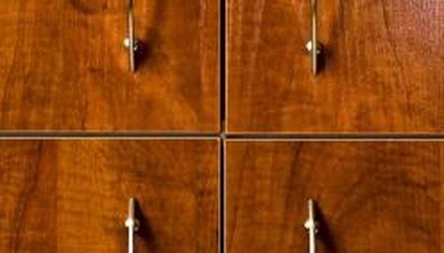 A thin layer of tinted clearcoat mimics stain on oak cabinets. A thin layer of tinted clearcoat mimics stain on oak cabinets.