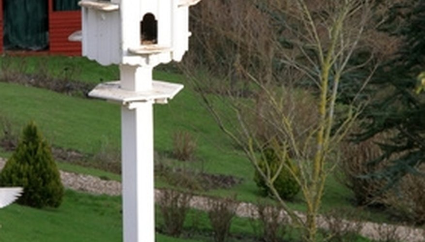 Wooden posts work well holding the purple martin bird house. Wooden posts work well holding the purple martin bird house.