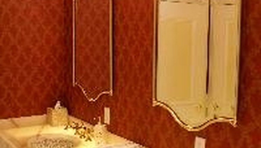 A set of bathroom sinks with outlets immediately above the sink. A set of bathroom sinks with outlets immediately above the sink.