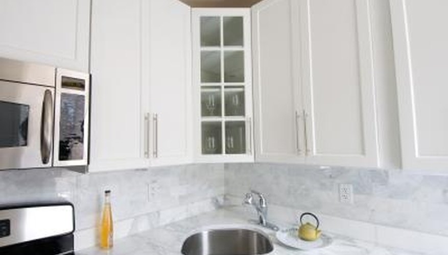 Clean grimy kitchen cabinets with common household products. Clean grimy kitchen cabinets with common household products.