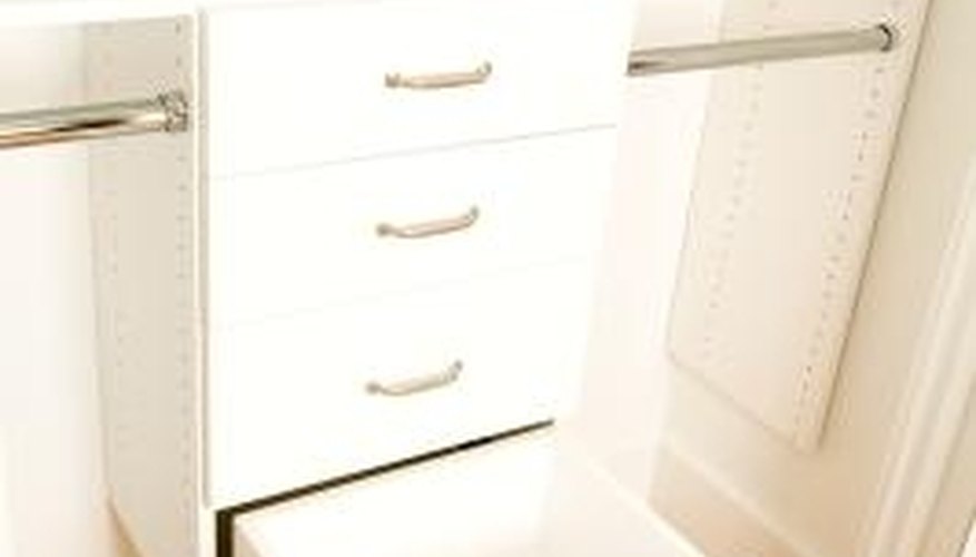 This closet organization system includes drawers and double hanging space. This closet organization system includes drawers and double hanging space.