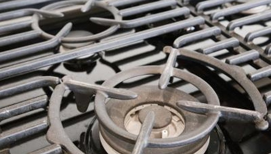 Older gas ovens can have a lot of dirt built up on them. Older gas ovens can have a lot of dirt built up on them.