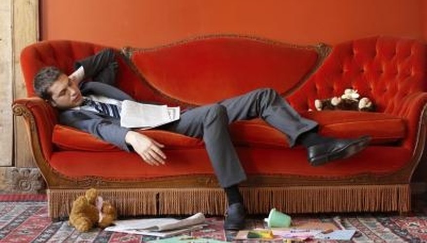 Warm colors like orange on the walls make this red sofa fit well into the decor of the room. Warm colors like orange on the walls make this red sofa fit well into the decor of the room.