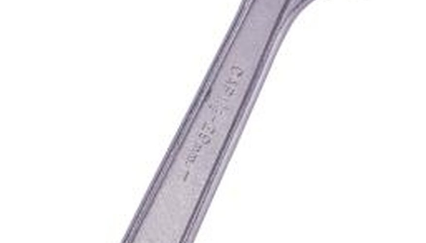 Remove the Y access fitting's end cap using an adjustable wrench. Remove the Y access fitting's end cap using an adjustable wrench.
