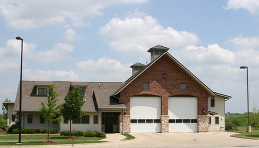 Photo Credit: suburban fire house image by Ray Kasprzak from <a href='http://www.fotolia.com'>Fotolia.com</a> Firehouse hall for rent