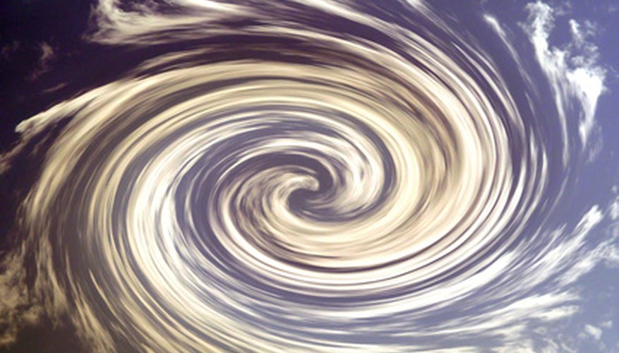 Photo Credit: hurricane clouds, background image by JoLin from <a href='http://www.fotolia.com'>Fotolia.com</a> An invest may morph into a hurricane or cyclone.