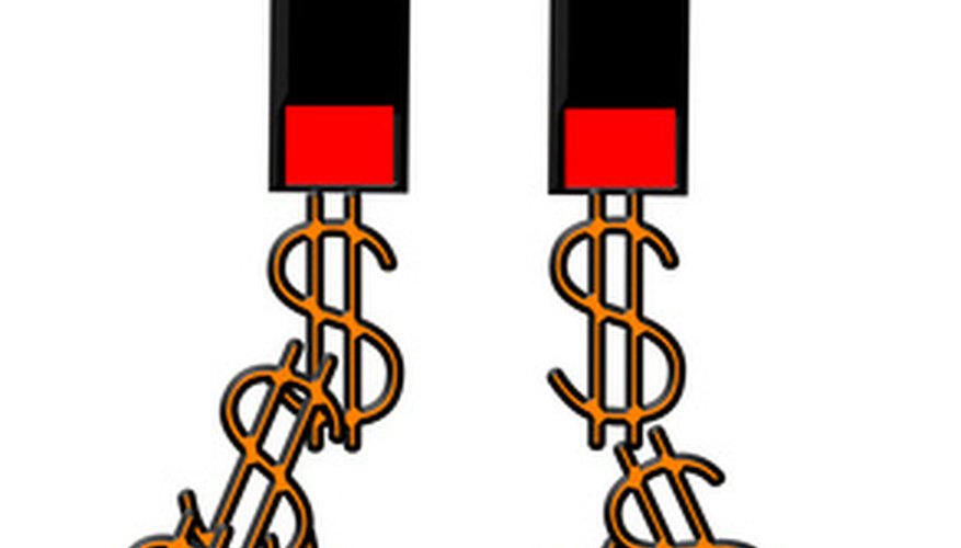 Photo Credit: magnet attracting dollar signs image by Steve Johnson from <a href='http://www.fotolia.com'>Fotolia.com</a> Children can have hours of fun studying the effects of magnetism.