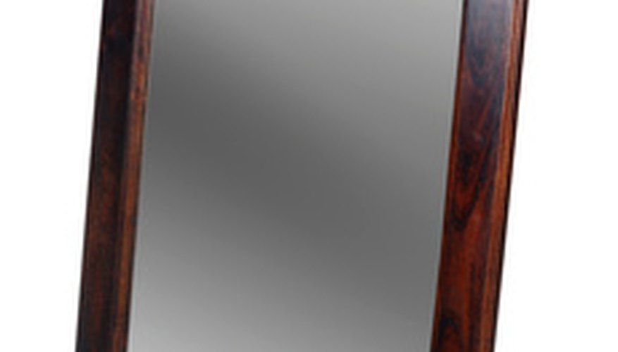 Lean a large mirror over the fireplace. Lean a large mirror over the fireplace.
