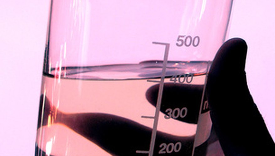 Photo Credit: glass image by Mikhail Olykainen from <a href='http://www.fotolia.com'>Fotolia.com</a> A beaker of oil to be tested