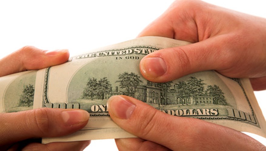 Photo Credit: getting money image by Vasiliy Koval from <a href='http://www.fotolia.com'>Fotolia.com</a> Producer surplus measures the producer's ability to accept a lower selling price point.