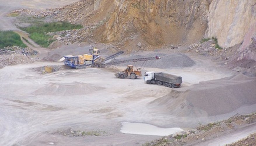 Photo Credit: limestone mine image by Alex White from <a href='http://www.fotolia.com'>Fotolia.com</a> Farmers add limestone to their soil to make the pH more basic.