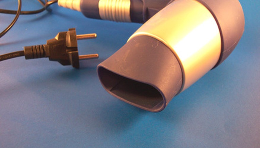Liquefy hardened wax in the washing machine with the hair dryer. Liquefy hardened wax in the washing machine with the hair dryer.
