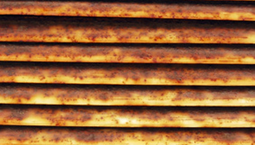 Photo Credit: rusted vent image by Karin Lau from <a href='http://www.fotolia.com'>Fotolia.com</a> Air scrubbers remove particulate matter.