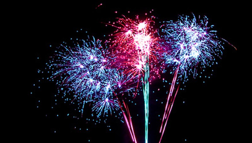 Photo Credit: Fireworks image by Dazzler from <a href='http://www.fotolia.com'>Fotolia.com</a> The color of fireworks depends on their constituent elements.