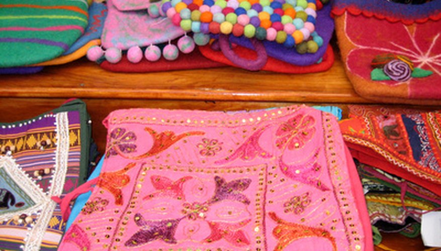 Photo Credit: hand crafted items image by Susan Rae Tannenbaum from <a href='http://www.fotolia.com'>Fotolia.com</a> Handmade purses are an option of what to sell at a flea market.