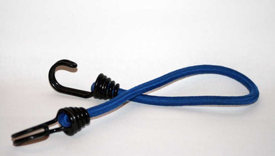 Bungee cords are easy to get and work well to keep the curtain in place. Bungee cords are easy to get and work well to keep the curtain in place.