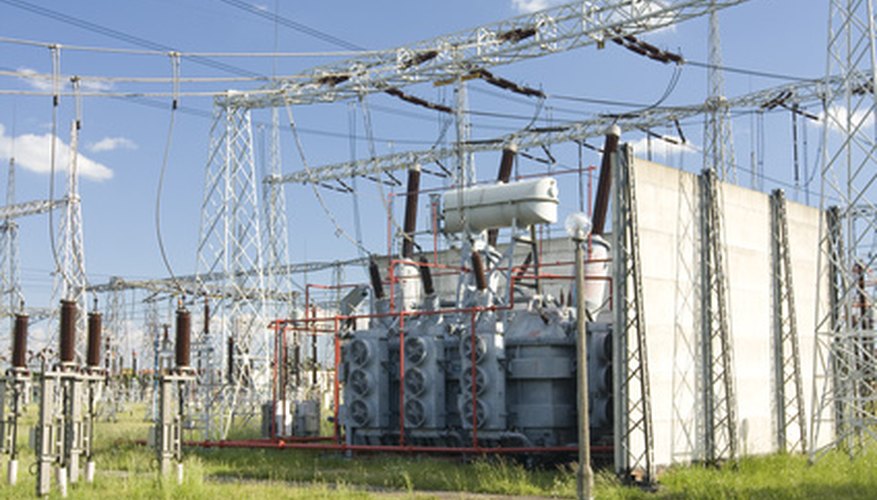 Photo Credit: High Voltage Transformer image by Andrzej Thiel from <a href='http://www.fotolia.com'>Fotolia.com</a> High-voltage transformers aid insulation.