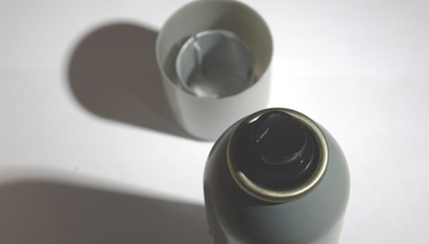 Photo Credit: grey spray with a cap image by Yasen Pramatarov from <a href='http://www.fotolia.com'>Fotolia.com</a> Thermodynamics explains why compressed air gets so cold.
