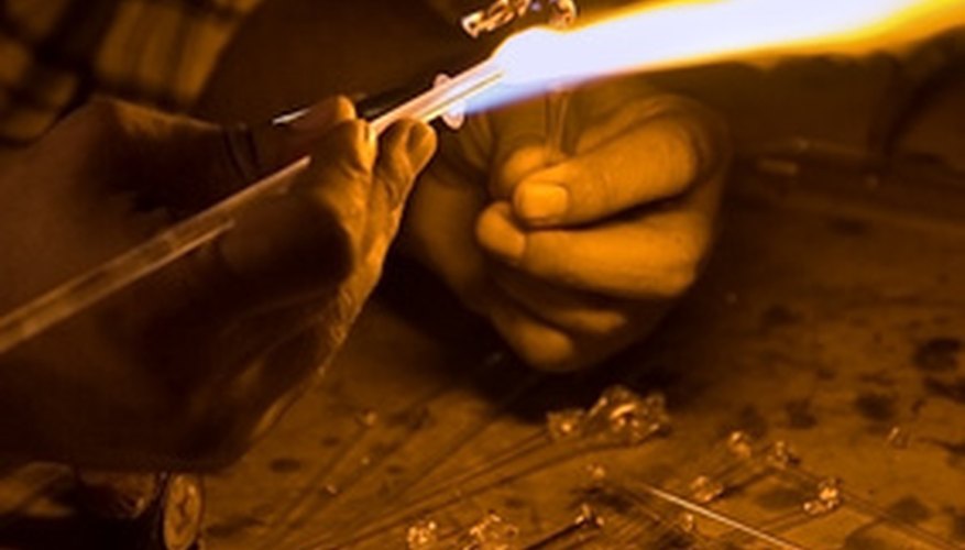 Photo Credit: craftsman's hands image by Kushnirov Avraham from <a href='http://www.fotolia.com'>Fotolia.com</a> A hydrogen torch burns hotter and cleaner than a traditional blow torch.