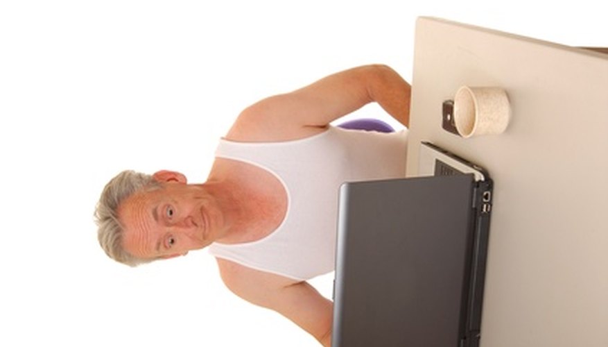 Photo Credit: senior businessman image by Paul Moore from <a href='http://www.fotolia.com'>Fotolia.com</a> Tutor seniors on computers