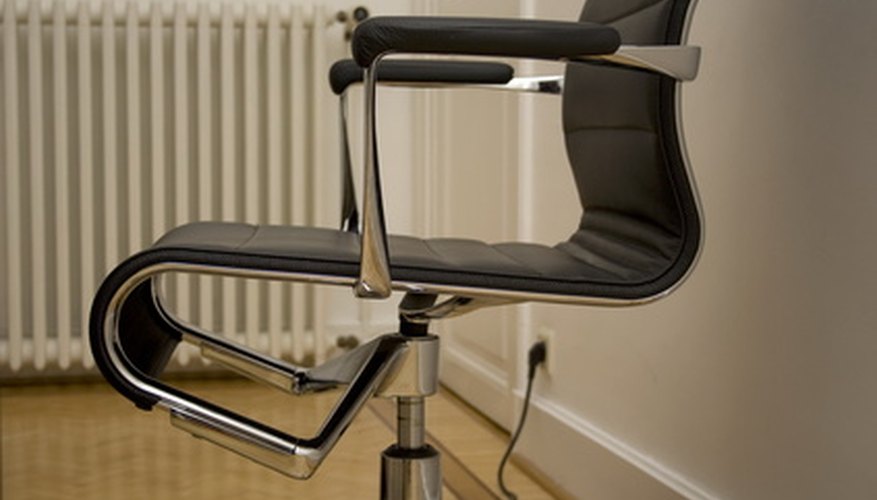 Photo Credit: office chair image by Ekaterina Sidorenko from <a href='http://www.fotolia.com'>Fotolia.com</a> Ergonomically designed furniture can reduce the risk of injury.