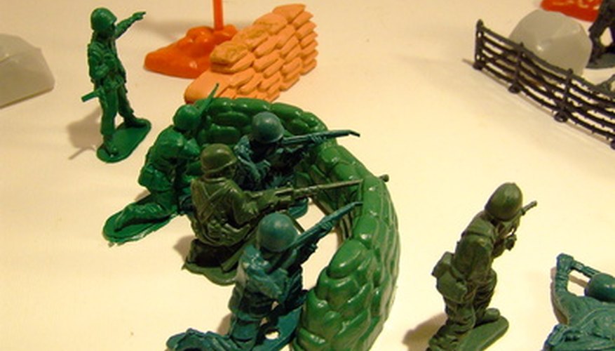 Photo Credit: fucilieri image by domyre from <a href='http://www.fotolia.com'>Fotolia.com</a> Use toy army figures to enhance the battlefield scene.