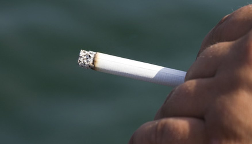 Photo Credit: cigarette image by bright from <a href='http://www.fotolia.com'>Fotolia.com</a> Cities continue to ban smoking in public places. Are cell phones next?