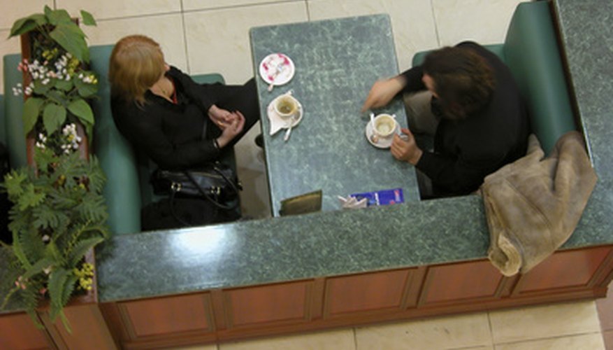 Photo Credit: the meeting, view from above image by Oleg Mitiukhin from <a href='http://www.fotolia.com'>Fotolia.com</a> Do you discuss business over coffee?