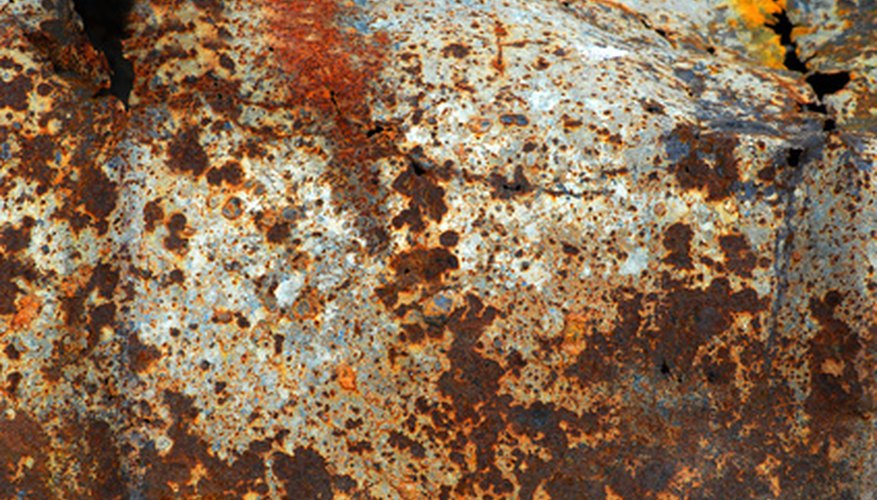 Photo Credit: rust image by sasha from <a href='http://www.fotolia.com'>Fotolia.com</a> Rust pits and corrodes metal parts.
