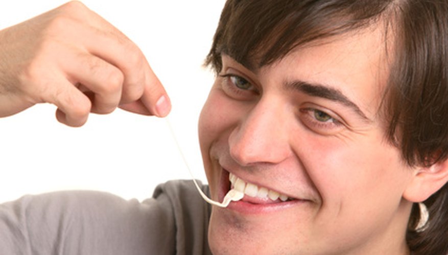 Photo Credit: man with gum image by Alexander Zhiltsov from <a href='http://www.fotolia.com'>Fotolia.com</a> Test how long the chewing gum flavor lasts.