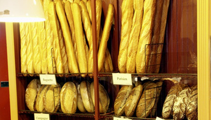 Parisian boulangeries showcase baked goods in glass cases and towering baskets. Parisian boulangeries showcase baked goods in glass cases and towering baskets.
