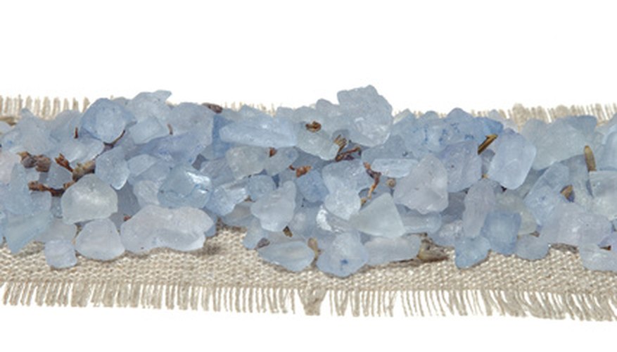 Photo Credit: Sea salt 2 image by Smalik from <a href='http://www.fotolia.com'>Fotolia.com</a> Sea salt will dissolve in water to create a solution.