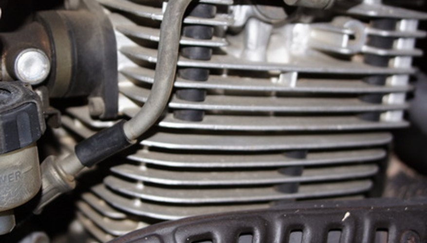 Photo Credit: motor image by Pablo Armelles from <a href='http://www.fotolia.com'>Fotolia.com</a> Car engines are often measured in horsepower.