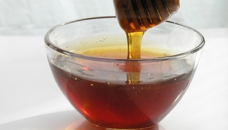 Photo Credit: honey image by Maria Brzostowska from <a href='http://www.fotolia.com'>Fotolia.com</a> Viscosity is a measure of a fluid's resistance to flow