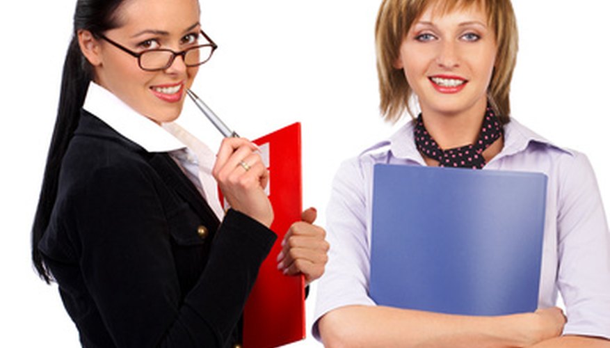 Photo Credit: business women image by Kurhan from <a href='http://www.fotolia.com'>Fotolia.com</a> Communication between co-workers is essential to good business.