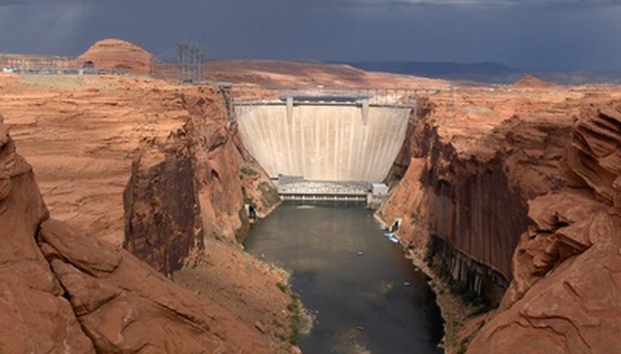 Photo Credit: Glen Canyon Dam image by TurboJJJ from <a href='http://www.fotolia.com'>Fotolia.com</a> Dams help to change the physical landscape