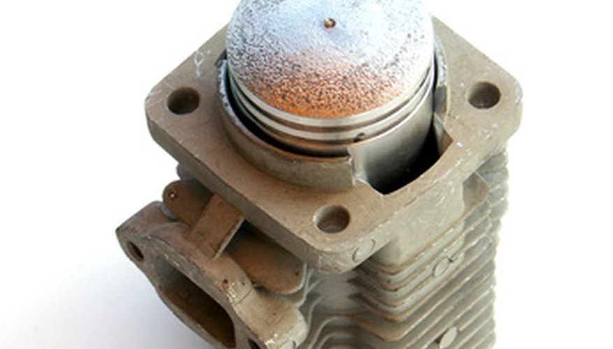 Photo Credit: cylindre et piston image by Unclesam from <a href='http://www.fotolia.com'>Fotolia.com</a> Double acting pneumatic cylinders are faster and stronger than other types of pneumatic cylinders.