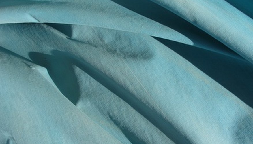 A canvas tarp is a suitable choice for a roll-up curtain. A canvas tarp is a suitable choice for a roll-up curtain.