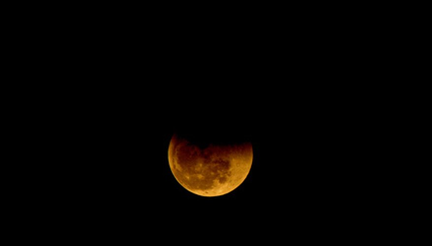 Photo Credit: Total Lunar Eclipse image by Toto from <a href='http://www.fotolia.com'>Fotolia.com</a>