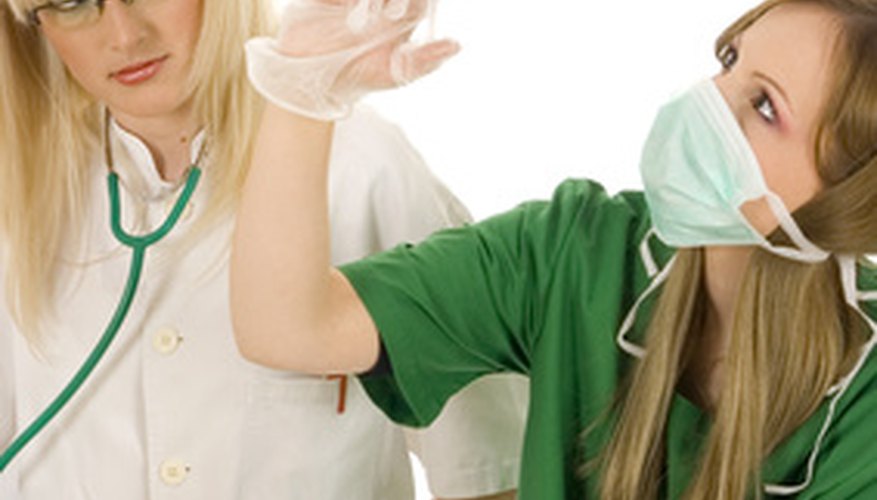 Photo Credit: medical team with nurse holding syringe getting ready for an inj image by asiana from <a href='http://www.fotolia.com'>Fotolia.com</a> Effective teams solve problems through shared leadership.