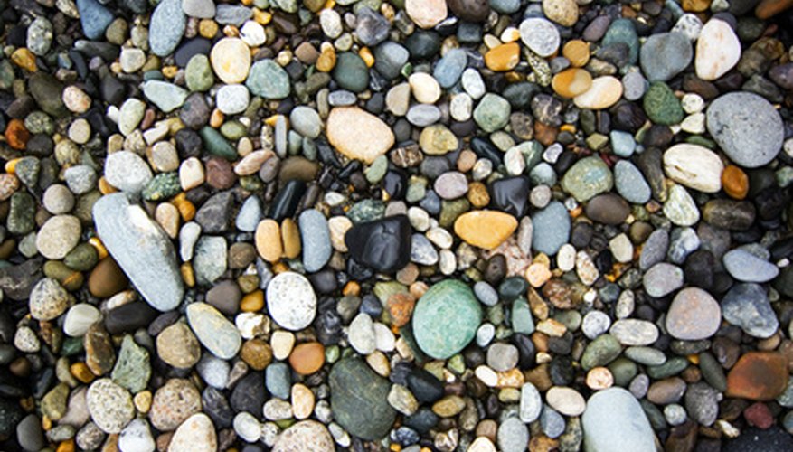 Photo Credit: rocks image by Mat Hayward from <a href='http://www.fotolia.com'>Fotolia.com</a> There are several ways to tell the difference between rocks and minerals.