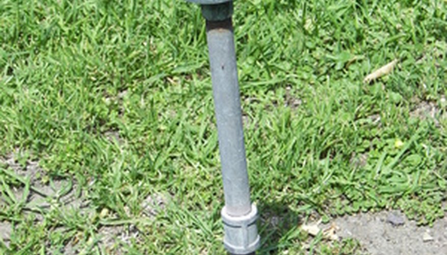 Photo Credit: sprinkler image by Joann Cooper from <a href='http://www.fotolia.com'>Fotolia.com</a> Pump curves calculate whether your pump will produce sufficient pressure for water systems.